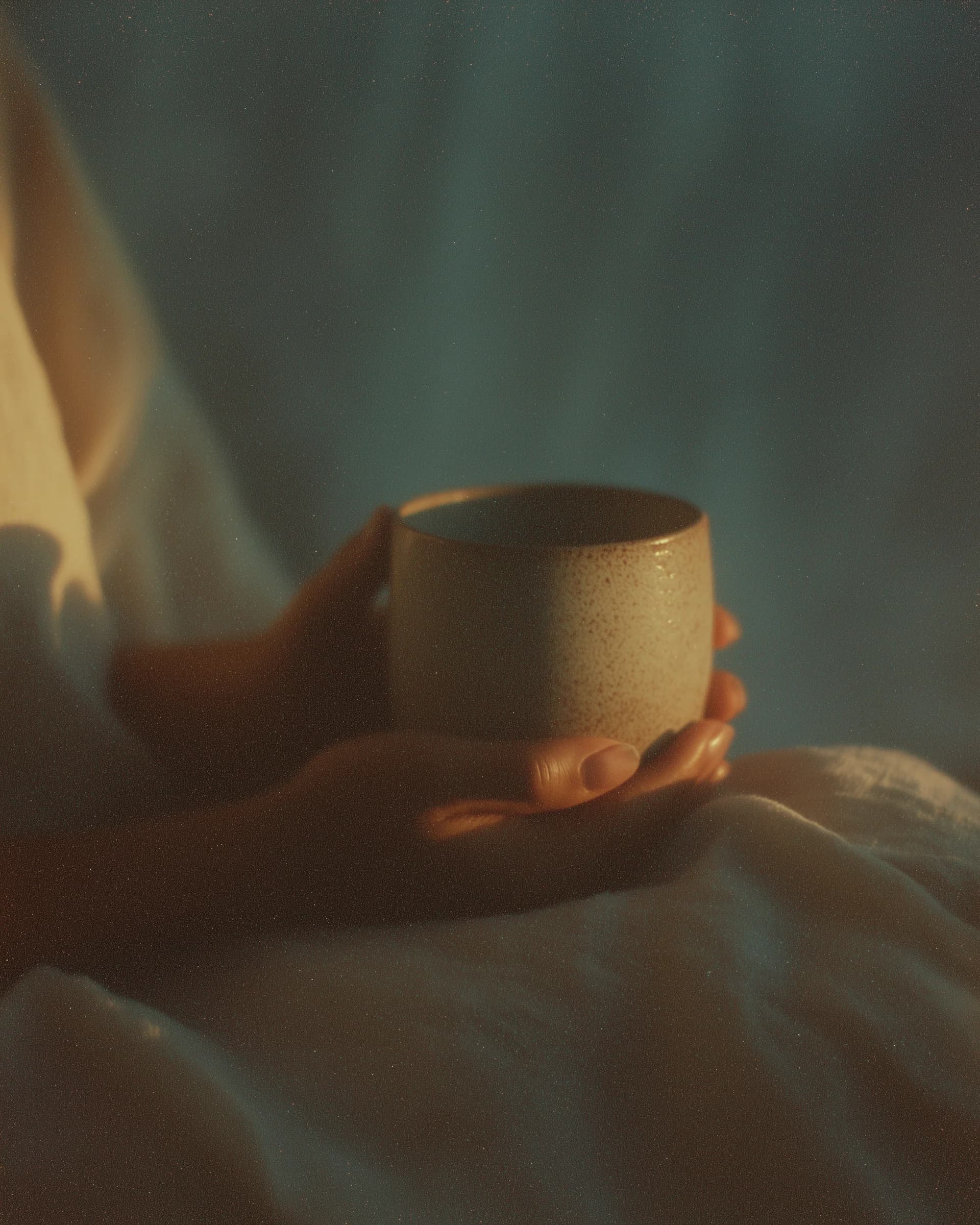 Hands wrapped around a warm mug at dawn.